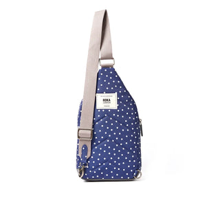 ROKA WILLESDEN SLING BAG IN NAVY POLKA DOT